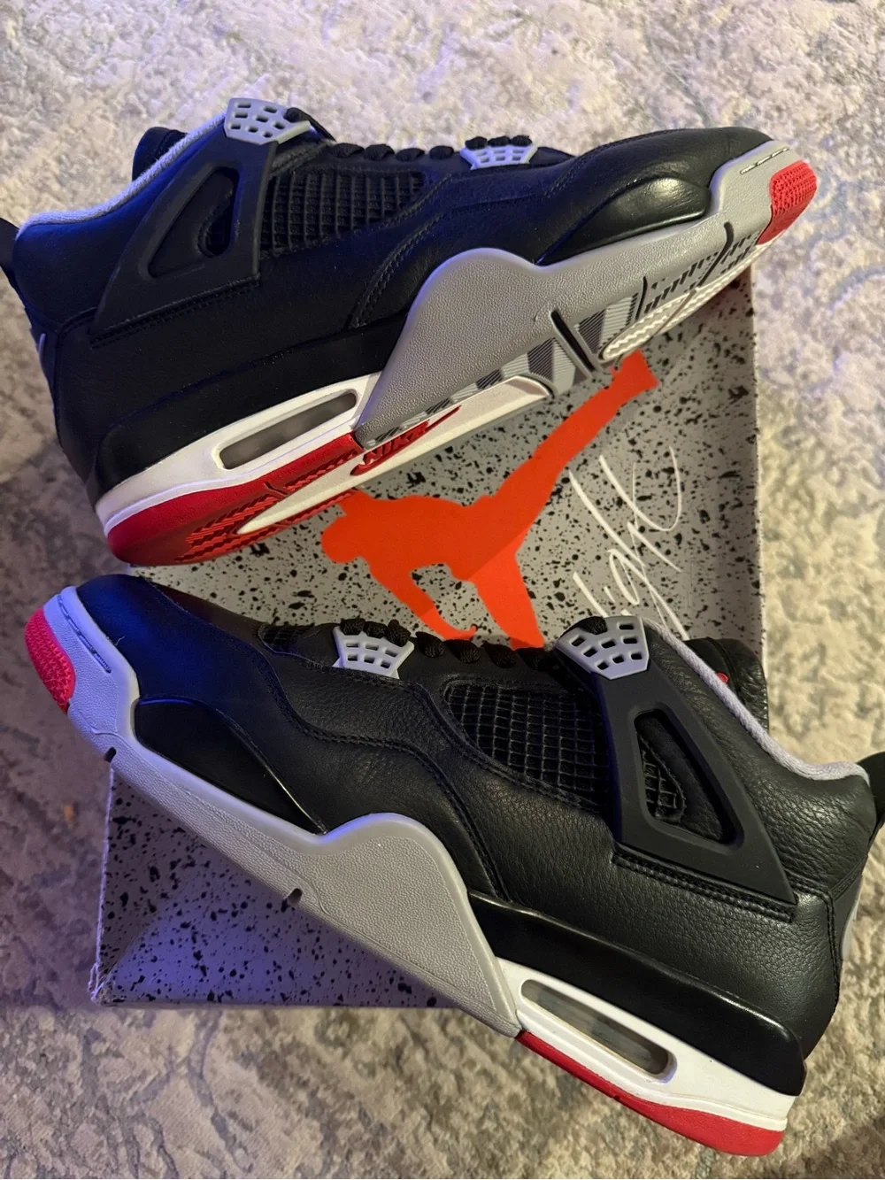 Jordan 4 Retro Bred Reimagined- Black/Red Retro-Style Sneakers